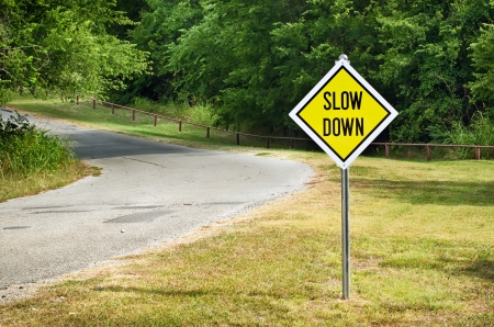 Slow down sign in the road